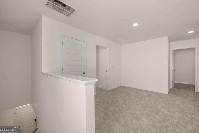 11884 Aukerman Way, Hampton, GA 30228 - empty room with light carpet, recessed lighting, and baseboards