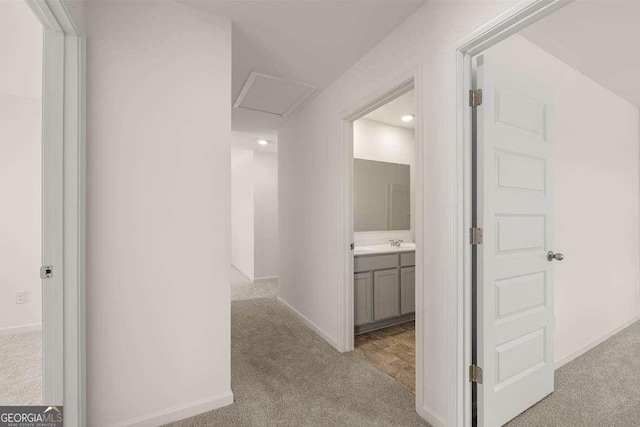 11884 Aukerman Way, Hampton, GA 30228 - hall with carpet floors, a sink, and baseboards