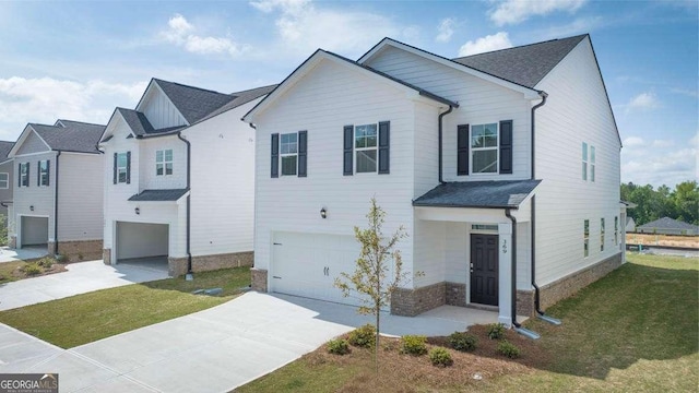 11884 Aukerman Way, Hampton, GA 30228 - view of front of home featuring a garage, driveway, and a front lawn