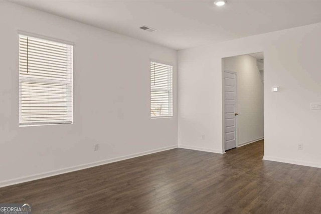 11884 Aukerman Way, Hampton, GA 30228 - empty room featuring dark wood-type flooring, baseboards, and recessed lighting