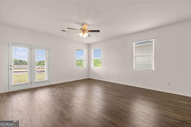 11884 Aukerman Way, Hampton, GA 30228 - spare room with a ceiling fan, dark wood-style floors, and baseboards