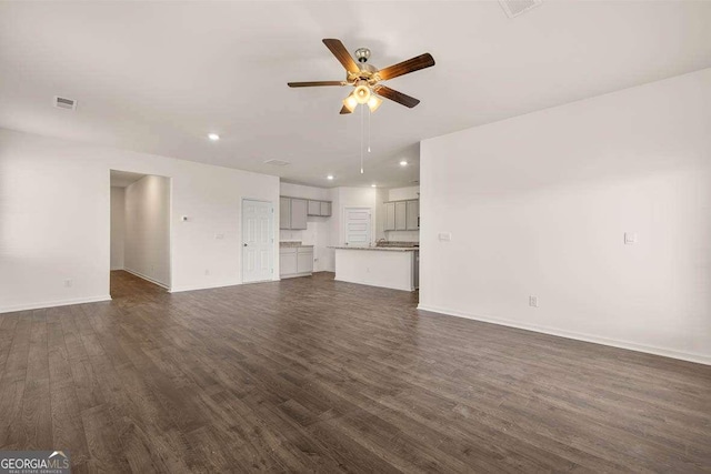 11884 Aukerman Way, Hampton, GA 30228 - unfurnished living room with a ceiling fan, dark wood-type flooring, recessed lighting, and baseboards