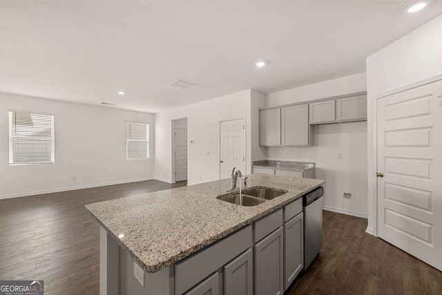 11884 Aukerman Way, Hampton, GA 30228 - kitchen featuring gray cabinetry, a sink, dishwasher, light stone countertops, and a kitchen island with sink