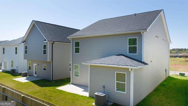 11884 Aukerman Way, Hampton, GA 30228 - back of house with cooling unit, a patio area, a lawn, and roof with shingles