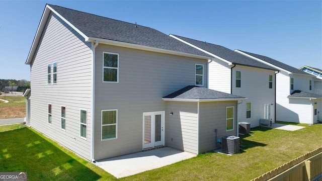 11884 Aukerman Way, Hampton, GA 30228 - rear view of house featuring a yard, a patio, and central air condition unit