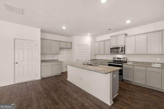 11884 Aukerman Way, Hampton, GA 30228 - kitchen with stainless steel appliances, gray cabinetry, dark wood-type flooring, and recessed lighting