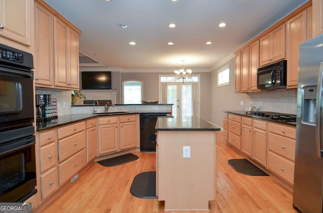 1570 Woodberry Run Dr, Snellville, GA 30078 - kitchen with black appliances, ornamental molding, a peninsula, light brown cabinets, and backsplash