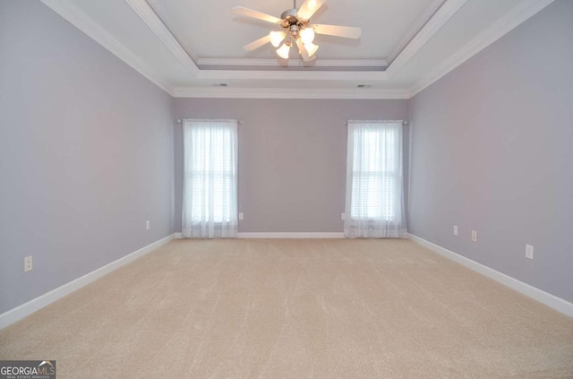 1570 Woodberry Run Dr, Snellville, GA 30078 - spare room with a raised ceiling, healthy amount of natural light, a ceiling fan, light colored carpet, and crown molding