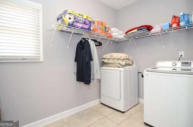 1570 Woodberry Run Dr, Snellville, GA 30078 - laundry area with separate washer and dryer and light tile patterned floors