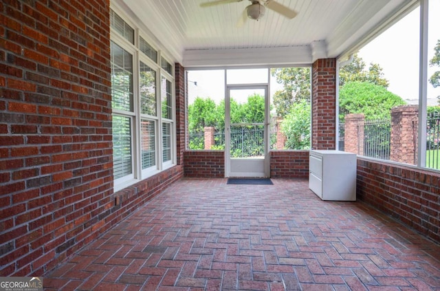 1570 Woodberry Run Dr, Snellville, GA 30078 - unfurnished sunroom with a ceiling fan, brick flooring, plenty of natural light, wooden ceiling, and brick wall
