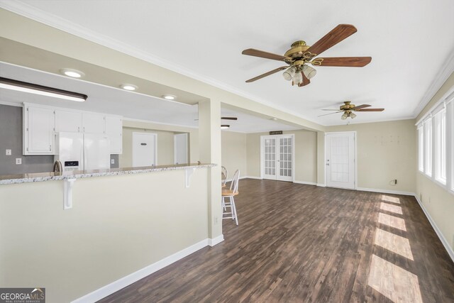 172B Hummingbird Ln, Jackson, GA 30233 - unfurnished living room with ceiling fan, crown molding, dark wood finished floors, and recessed lighting