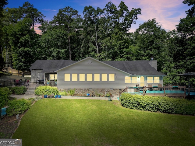 172B Hummingbird Ln, Jackson, GA 30233 - back of house featuring a yard, a chimney, and a deck