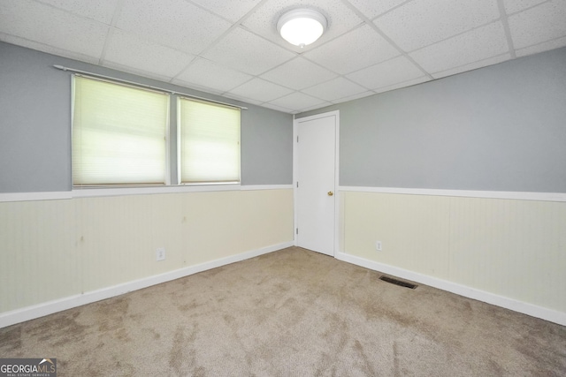 172B Hummingbird Ln, Jackson, GA 30233 - unfurnished room featuring carpet floors, a paneled ceiling, and wainscoting