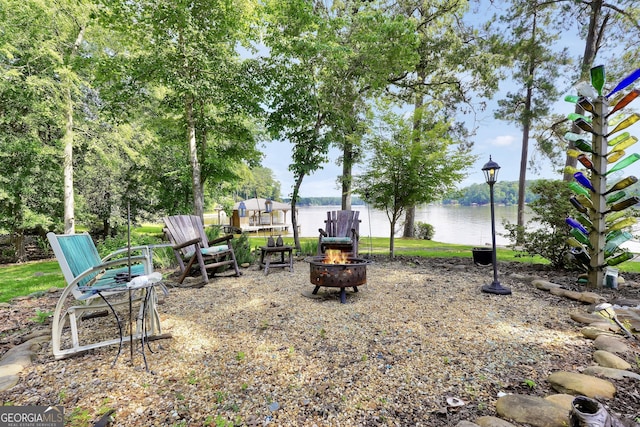 172B Hummingbird Ln, Jackson, GA 30233 - view of yard featuring an outdoor fire pit and a water view
