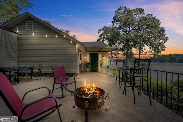 172B Hummingbird Ln, Jackson, GA 30233 - view of patio / terrace featuring a fire pit and a water view