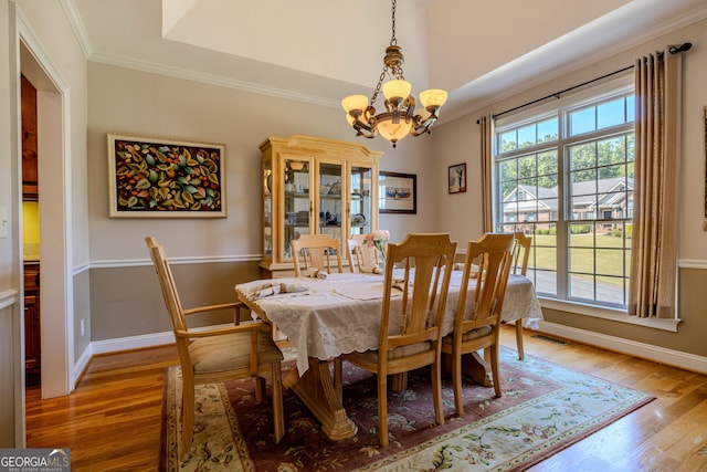 31 Bluff Mountain Dr SW, Rome, GA 30165 - dining area featuring a chandelier, light wood-style flooring, and crown molding