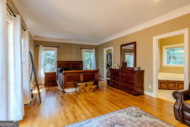 31 Bluff Mountain Dr SW, Rome, GA 30165 - bedroom featuring wood finished floors, crown molding, a walk in closet, ensuite bath, and a closet