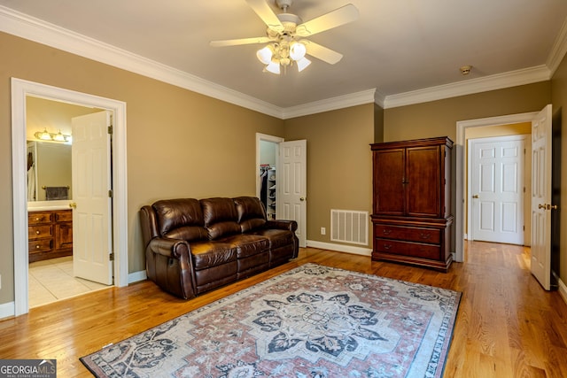 31 Bluff Mountain Dr SW, Rome, GA 30165 - living area with crown molding, ceiling fan, and light wood-style flooring