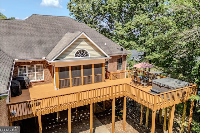 31 Bluff Mountain Dr SW, Rome, GA 30165 - rear view of property with brick siding, a deck, a shingled roof, and a sunroom