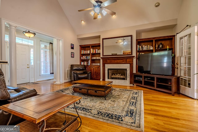 31 Bluff Mountain Dr SW, Rome, GA 30165 - living area featuring a ceiling fan, ornate columns, a high end fireplace, light wood-type flooring, and high vaulted ceiling