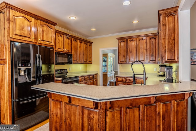 31 Bluff Mountain Dr SW, Rome, GA 30165 - kitchen featuring black appliances, a peninsula, ornamental molding, recessed lighting, and light countertops