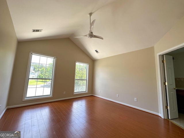 2355 Brick Mill Ct, Duluth, GA 30096 - spare room with a ceiling fan, dark wood-style floors, and vaulted ceiling