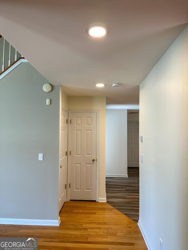 2355 Brick Mill Ct, Duluth, GA 30096 - corridor with wood finished floors, stairway, and recessed lighting