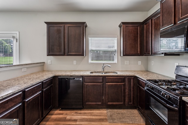 98 Concord Pl, Hiram, GA 30141 - kitchen with black appliances, healthy amount of natural light, dark brown cabinetry, and wood finished floors
