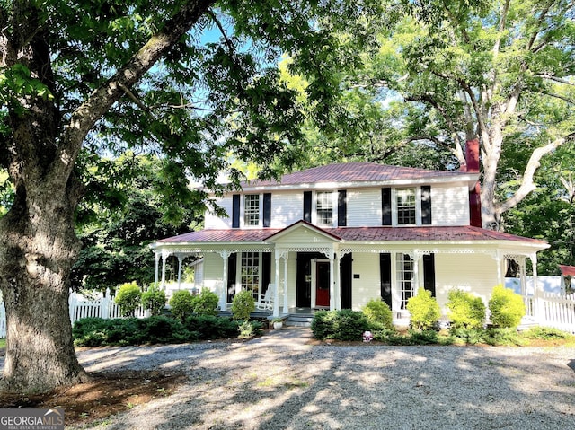 209 Athens St, Jefferson, GA 30549 - view of front of home featuring a porch, a chimney, and metal roof