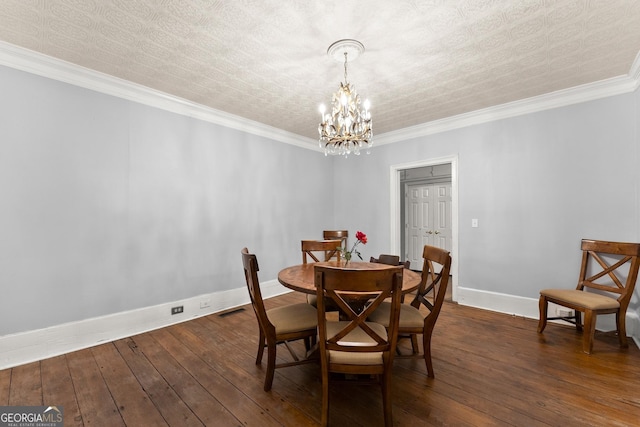 209 Athens St, Jefferson, GA 30549 - dining space with a chandelier, dark wood-style floors, baseboards, and crown molding