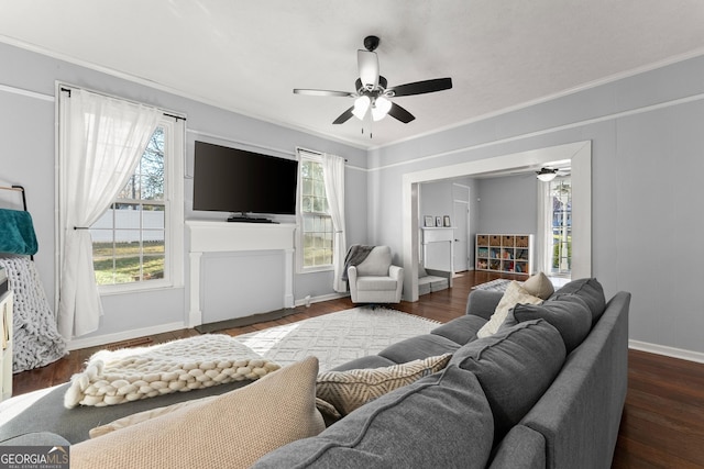 209 Athens St, Jefferson, GA 30549 - living area featuring ceiling fan, ornamental molding, baseboards, and dark wood-style flooring