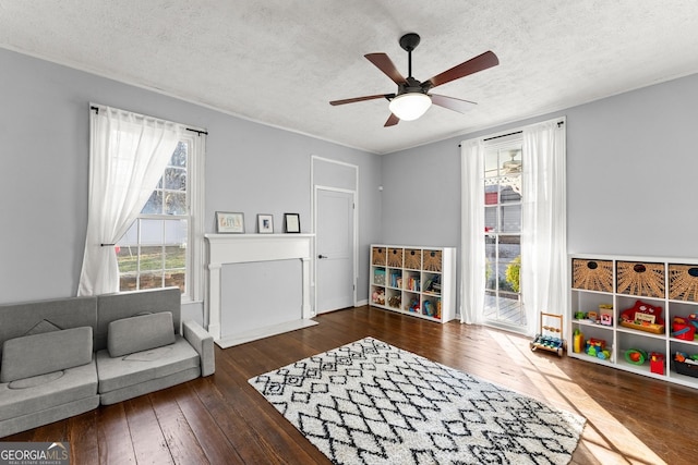 209 Athens St, Jefferson, GA 30549 - living room with a textured ceiling, wood-type flooring, and a ceiling fan