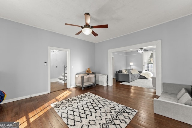209 Athens St, Jefferson, GA 30549 - living room with ceiling fan, dark wood-type flooring, stairway, and baseboards