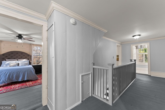 209 Athens St, Jefferson, GA 30549 - corridor featuring an upstairs landing, ornamental molding, wood finished floors, and baseboards