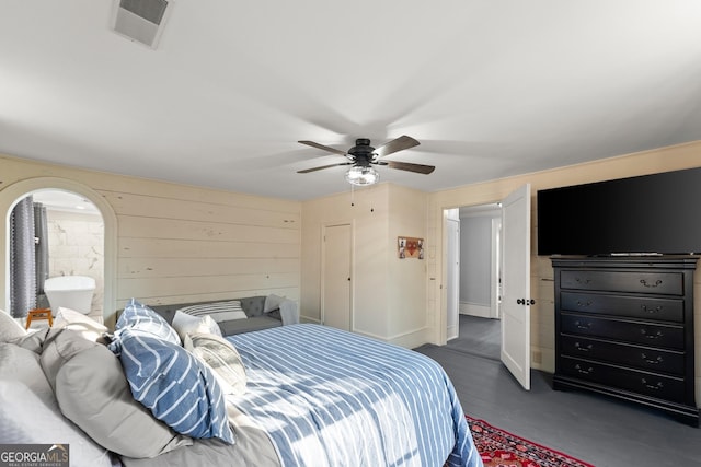 209 Athens St, Jefferson, GA 30549 - bedroom featuring ceiling fan and wood walls