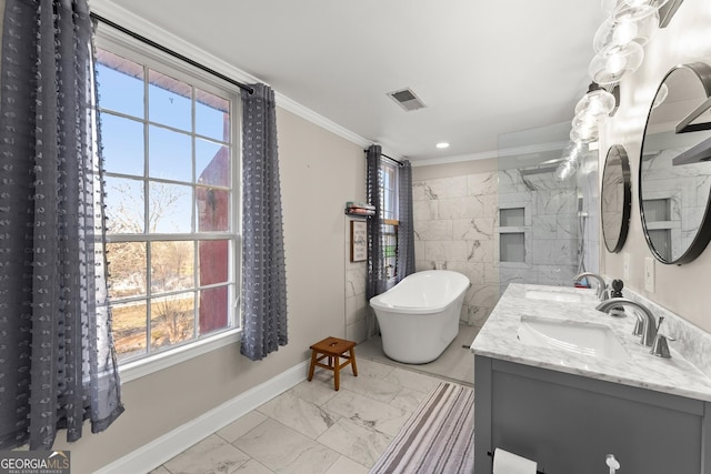 209 Athens St, Jefferson, GA 30549 - full bath featuring marble look tiles, baseboards, crown molding, plenty of natural light, and a freestanding bath