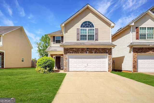 11151 Aliyah Dr, Hampton, GA 30228 - traditional-style house with driveway, an attached garage, a front lawn, and stone siding