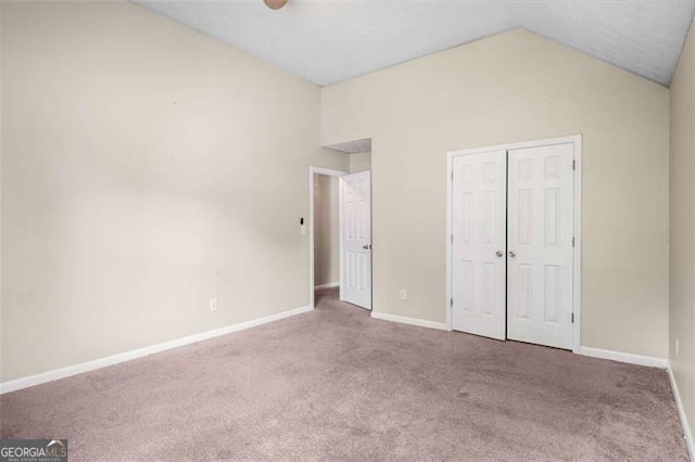 11151 Aliyah Dr, Hampton, GA 30228 - unfurnished bedroom featuring vaulted ceiling, carpet floors, a closet, and ceiling fan