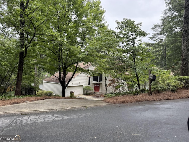 3836 Loch Highland Pkwy NE, Roswell, GA 30075 - view of property hidden behind natural elements featuring driveway
