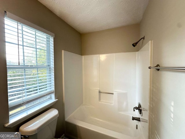 4320 Catalpa Way, Ellenwood, GA 30294 - full bathroom featuring toilet,  shower combination, and a textured ceiling