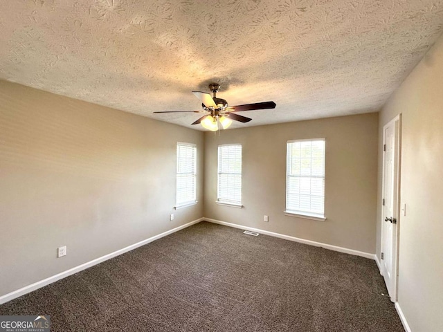 4320 Catalpa Way, Ellenwood, GA 30294 - empty room featuring a textured ceiling, a ceiling fan, dark colored carpet, and baseboards
