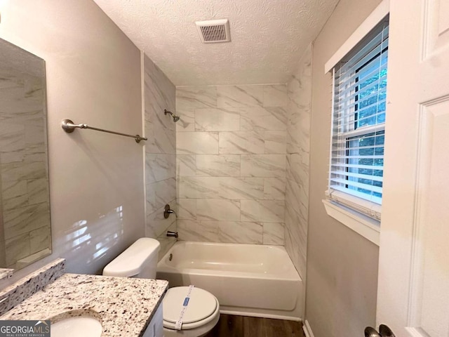 2784 Rockdale Dr, Decatur, GA 30034 - bathroom featuring a textured ceiling, vanity, toilet, bathtub / shower combination, and wood finished floors