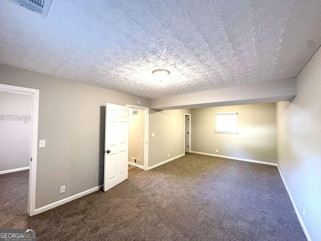 2784 Rockdale Dr, Decatur, GA 30034 - unfurnished bedroom featuring carpet, a textured ceiling, and baseboards