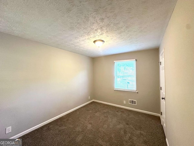 2784 Rockdale Dr, Decatur, GA 30034 - unfurnished room featuring baseboards, dark colored carpet, and a textured ceiling