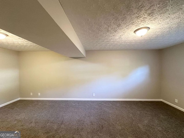 2784 Rockdale Dr, Decatur, GA 30034 - unfurnished room with a textured ceiling, dark colored carpet, and baseboards