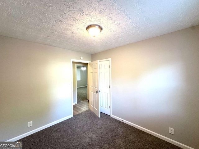 2784 Rockdale Dr, Decatur, GA 30034 - spare room with carpet, baseboards, and a textured ceiling
