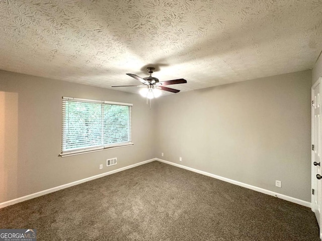 2784 Rockdale Dr, Decatur, GA 30034 - empty room with ceiling fan, baseboards, dark colored carpet, and a textured ceiling