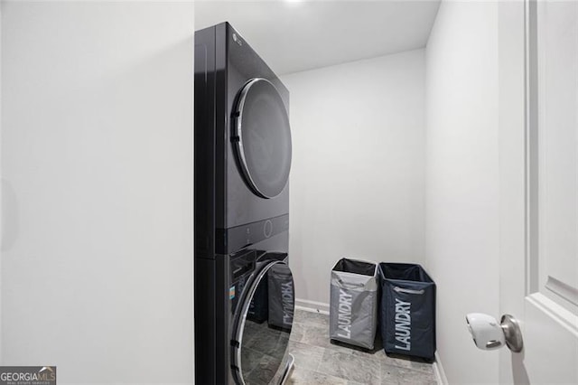 312 Deer Run Dr, Dallas, GA 30132 - laundry area with stacked washer / drying machine and baseboards