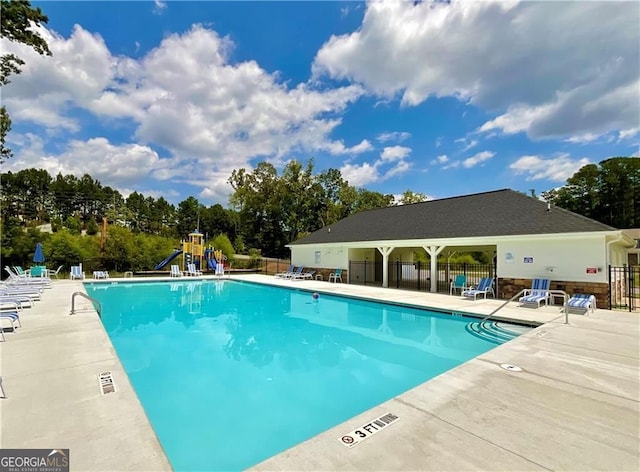 312 Deer Run Dr, Dallas, GA 30132 - community pool featuring a patio area