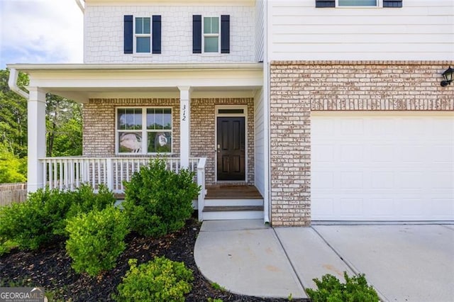 312 Deer Run Dr, Dallas, GA 30132 - entrance to property with brick siding, covered porch, and concrete driveway